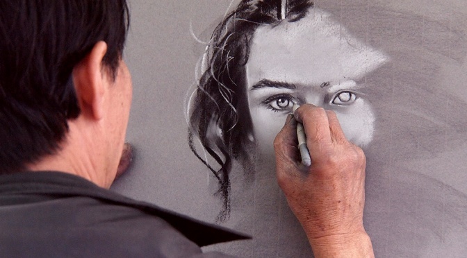 Man Sketching a Face